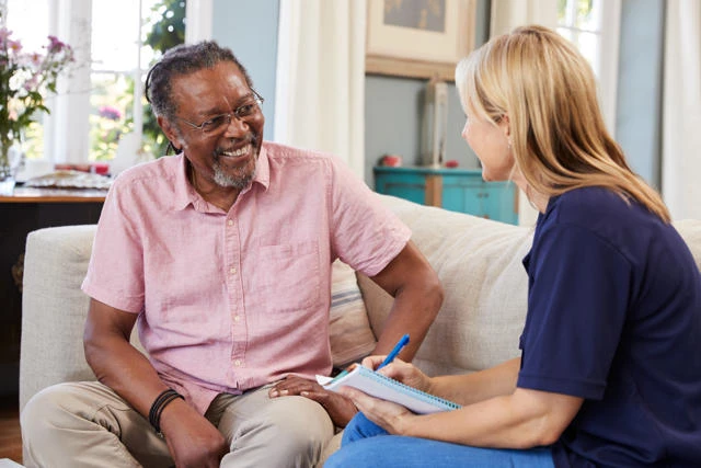 A support worker discusses a care plan with a client