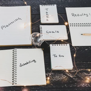 Notebooks scattered across a table