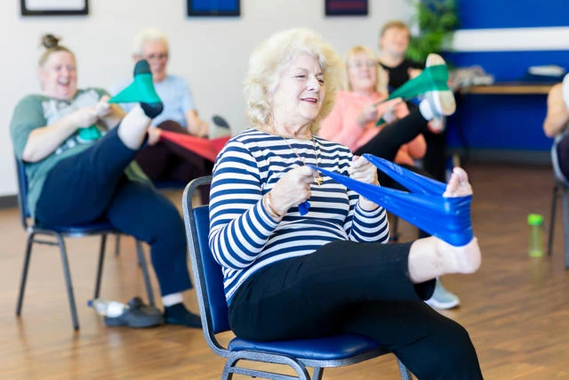 a seated exercise class is taking place