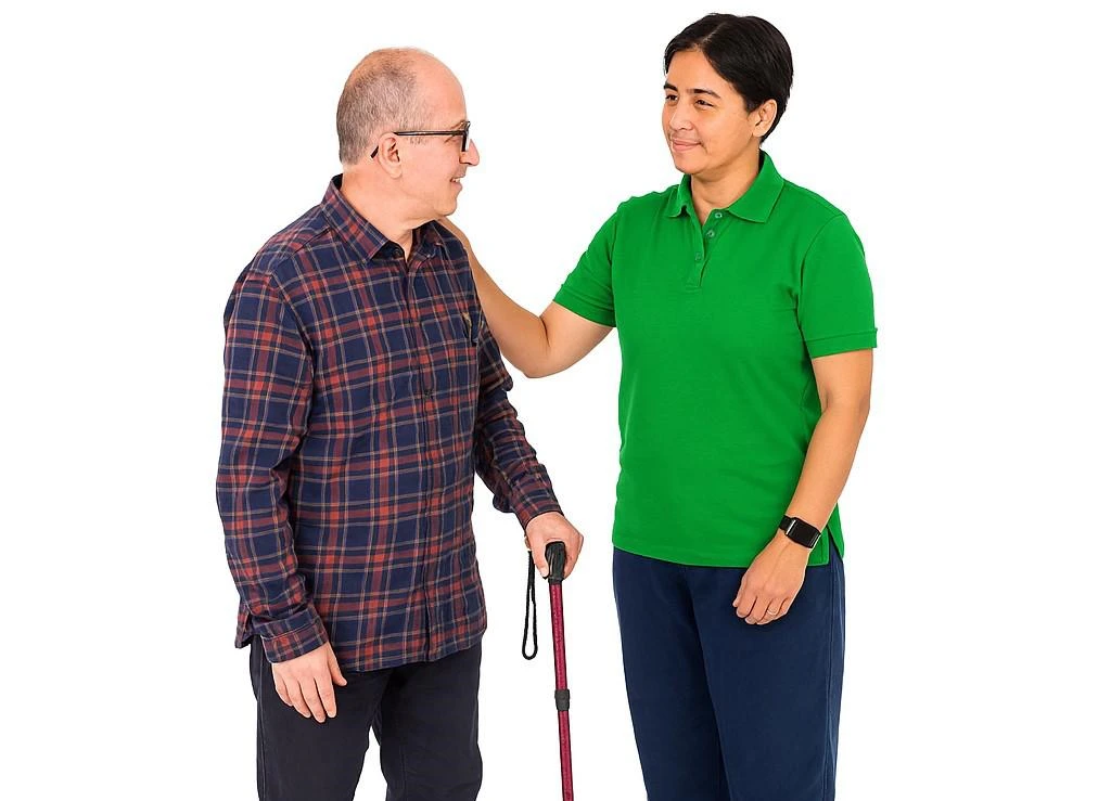 an older person with a learning disability is supported by a care worker