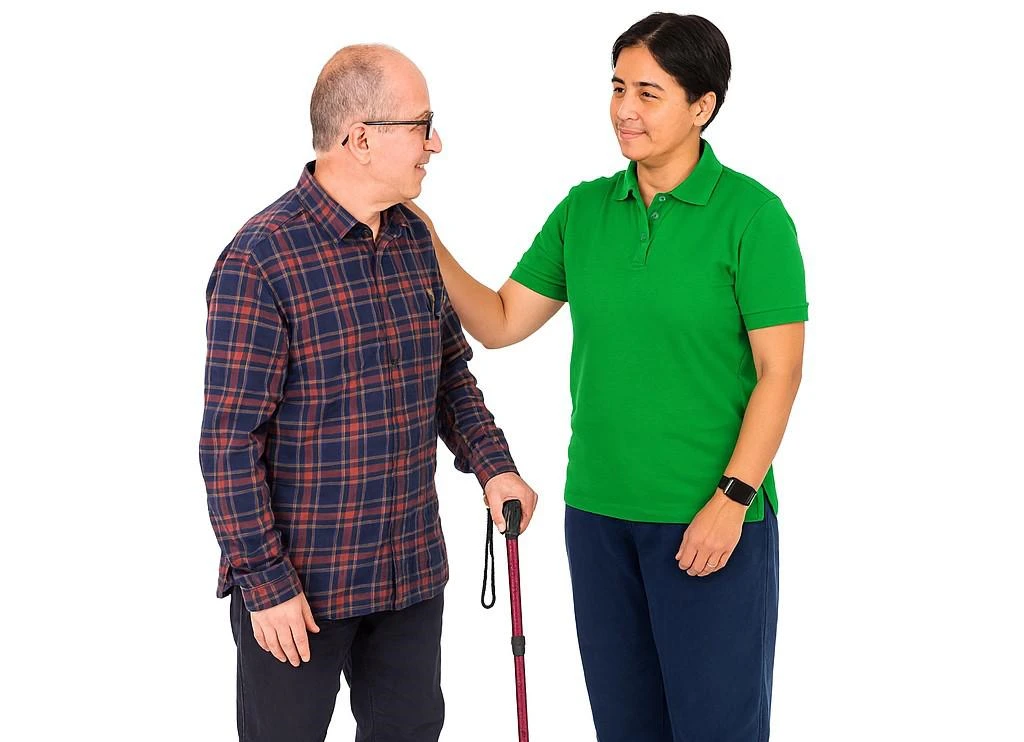 an older person with a learning disability is supported by a care worker