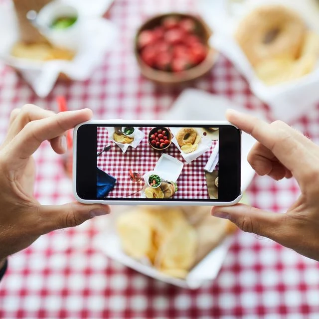 someone taking a photo using a smartphone