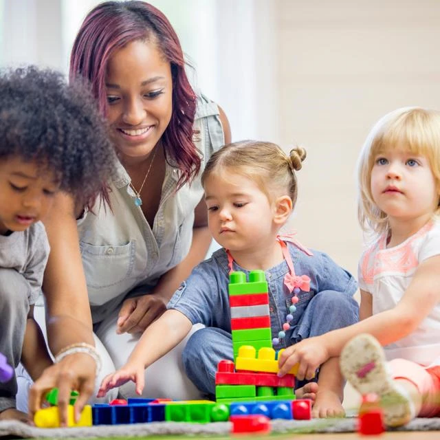 Female member of staff with three young children