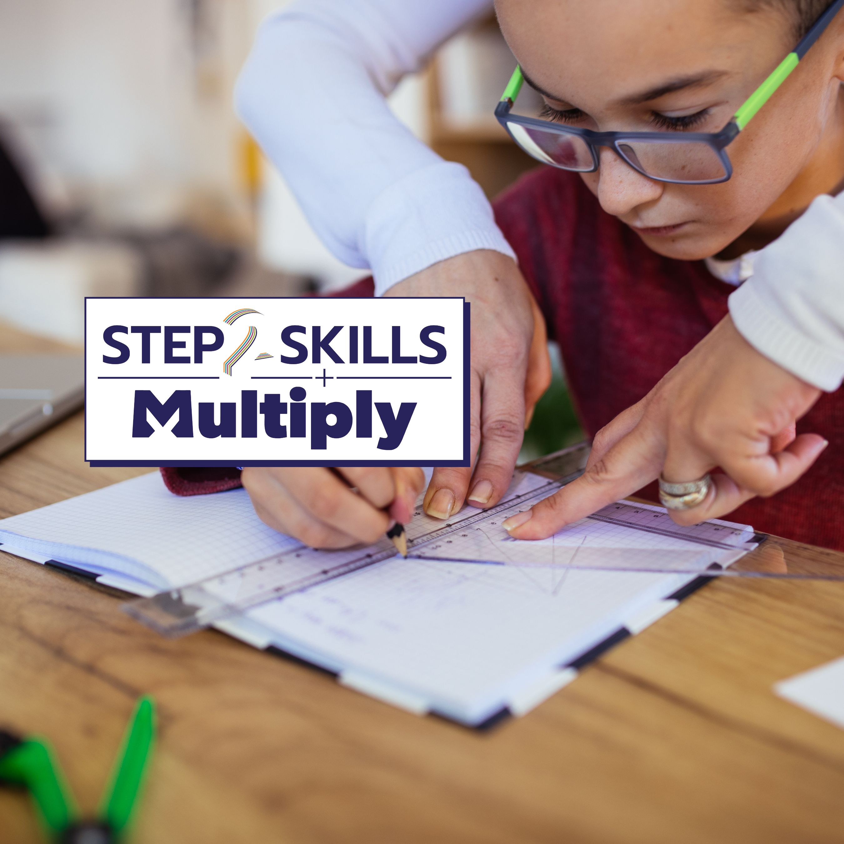 An image of a child using maths instruments and a notebook, being supported by an adult