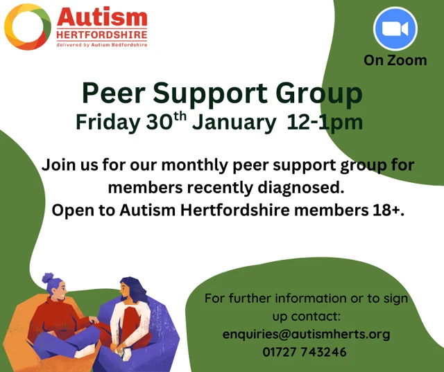 2 adults sitting on beanbags and chatting