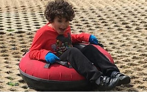 Child having fun on a doughnut