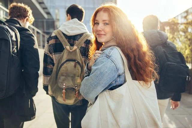 young person smiling on way to further education 
