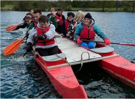 Photo of people in bell boat on a lake