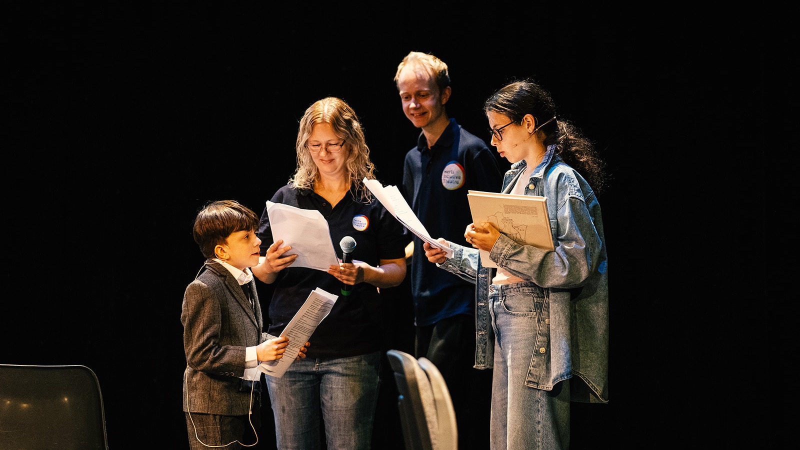 Image of young people reading a script