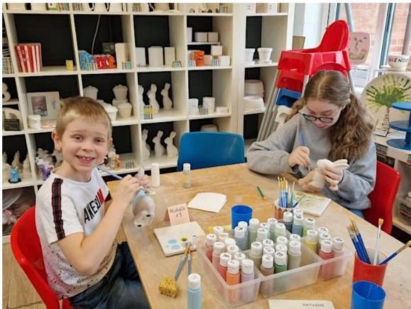 two children pottery painting