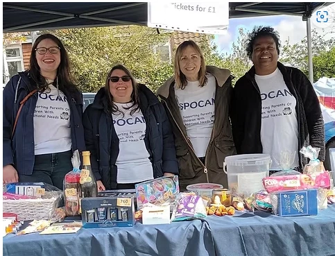 parents of the support group raising money at a stall