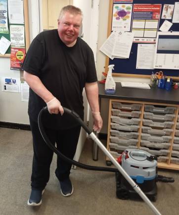 Man at work with a vacuum cleaner